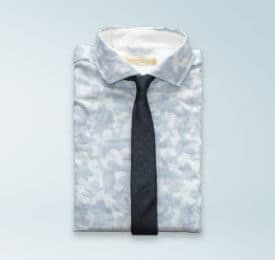 Blue Floral Spot Shirt photographed on a plain background