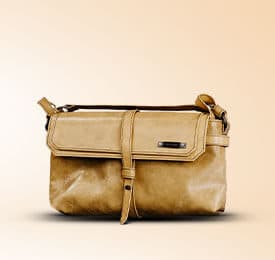 Quilted Leather Handbag In Brown photographed on a plain background