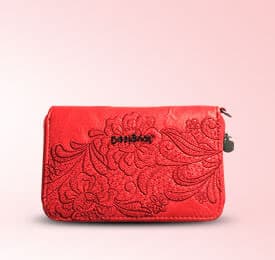 Organic Leather Handbag In Red photographed on a plain background
