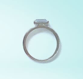 18k White Gold And Diamond Ring photographed on a plain background