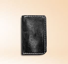 Black Real Leather Wallet photographed on a plain background