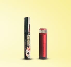 Volupte Shine Lipstick And Mascara photographed on a plain background