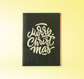 Handmade Christmas Greeting Card photographed on a plain background