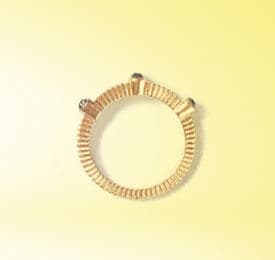 Rose Gold And Diamond Ring photographed on a plain background