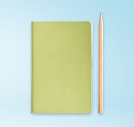 Office Notebook And Pencil photographed on a plain background